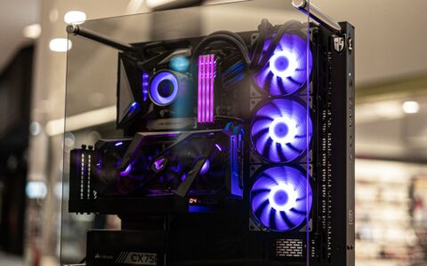 custom computer with vibrant LED fans and sleek glass design, showcasing high-performance components